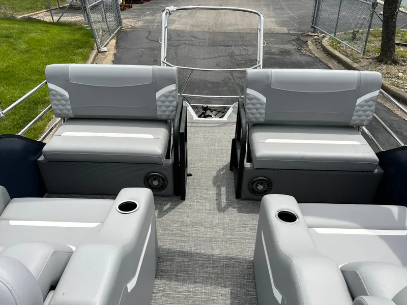 Slide: The Image of 2025 Crest Classic 220 SLRC pontoon boat interior with gray seating and cup holders. - 13