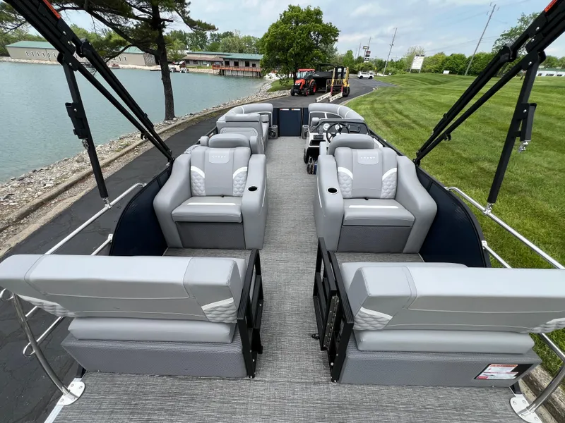 Slide: The Image of 2025 Crest Classic 220 SLRC pontoon boat with spacious seating and modern design. - 15