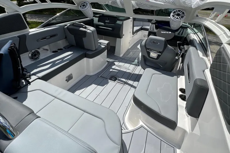 Slide: The Image of 2025 Chaparral 247 SSX boat interior with modern seating and sleek design. - 5