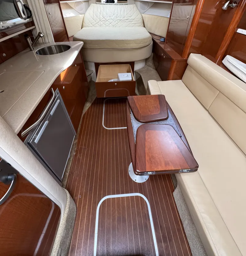 Slide: The Image of Luxurious interior of a 2008 Sea Ray 330 Sundancer yacht with wood accents and cozy seating. - 12