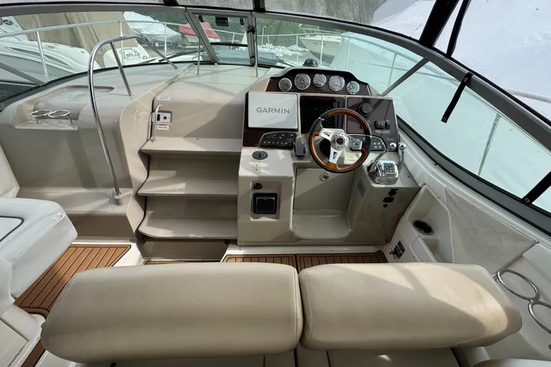 Slide: The Image of 2008 Sea Ray 330 Sundancer helm with Garmin navigation and luxurious seating. - 19
