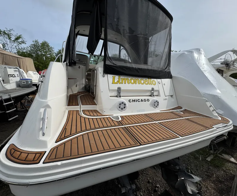 Slide: The Image of 2008 Sea Ray 330 Sundancer boat with teak deck, named "Limoncello," docked in Chicago. - 21