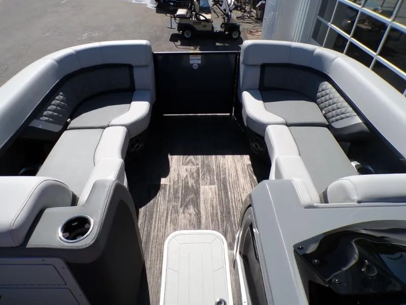Slide: The Image of Luxurious seating on 2025 Godfrey AquaPatio 255 SFL pontoon boat with stylish interior design. - 17