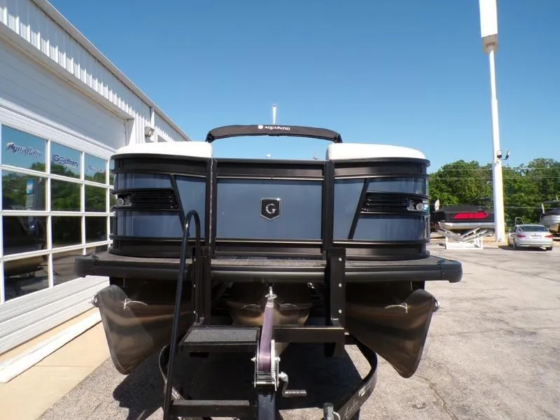 Slide: The Image of 2025 Godfrey AquaPatio 255 SFL iMPACT pontoon boat on trailer, front view. - 20