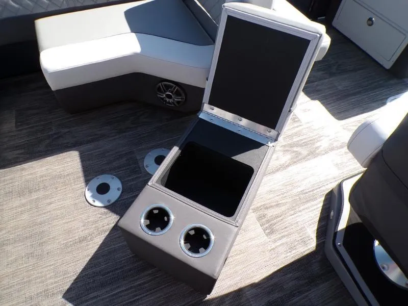 Slide: The Image of Interior of 2025 Godfrey AquaPatio 255 SFL with open storage and cup holders. - 22