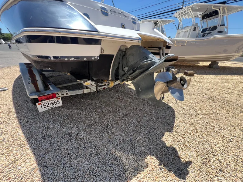 Slide: The Image of 2002 Chris-Craft 22 Launch Bow Rider on trailer, rear view with propeller visible. - 10