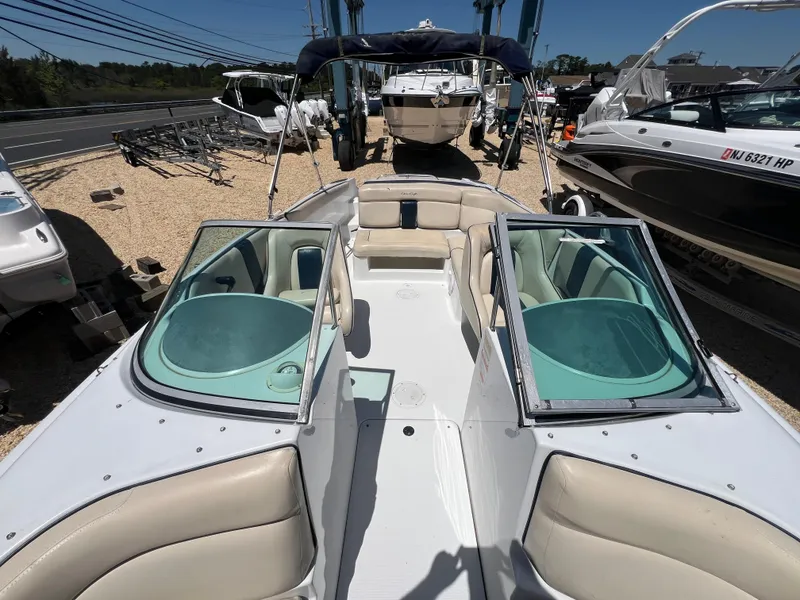 Slide: The Image of 2002 Chris-Craft 22 Launch Bow Rider with open seating and sleek design. - 20