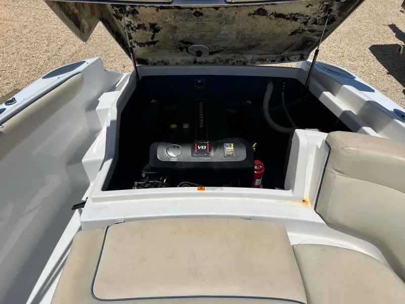 Slide: The Image of 2002 Chris-Craft 22 Launch Bow Rider engine compartment with open hatch. - 22