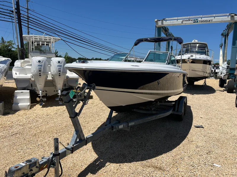 Slide: The Image of 2002 Chris-Craft 22 Launch Bow Rider on trailer in boatyard. - 4