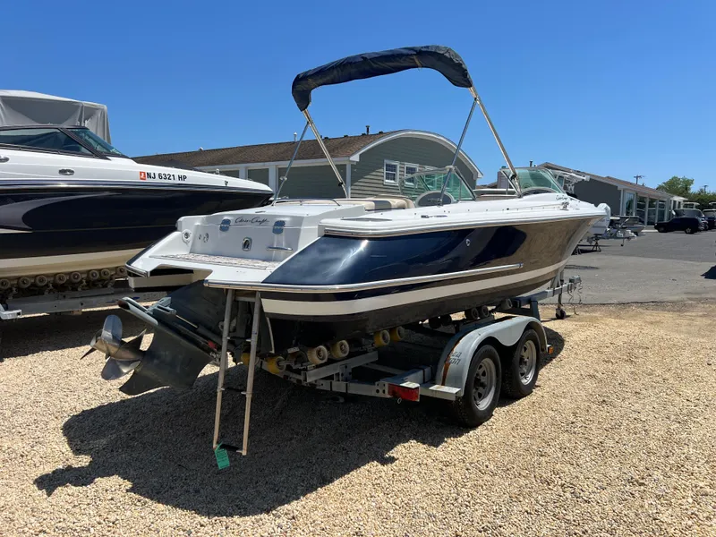 Slide: The Image of 2002 Chris-Craft 22 Launch Bow Rider on trailer, parked outdoors. - 7