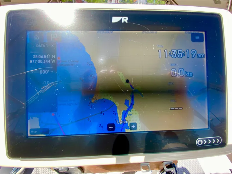 Slide: The Image of Boat navigation screen showing map and coordinates, Valiant 37, 1979 model. - 10