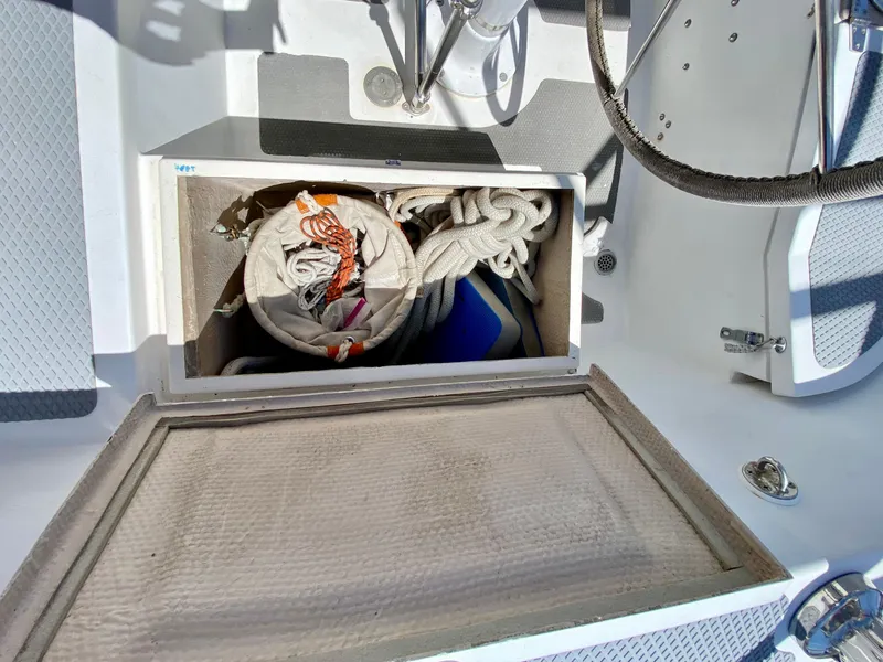 Slide: The Image of 1979 Valiant 37 sailboat cockpit storage with ropes and equipment. - 16