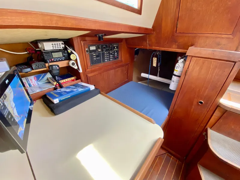 Slide: The Image of 1979 Valiant 37 yacht interior with navigation equipment and cozy sleeping area. - 30
