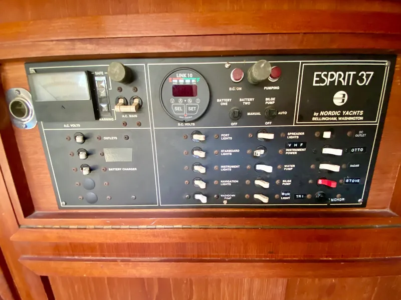 Slide: The Image of Electrical control panel of a 1979 Valiant 37 yacht, featuring various switches and meters. - 31