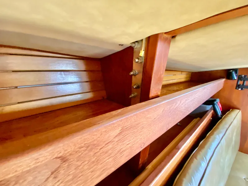 Slide: The Image of Interior view of 1979 Valiant 37 sailboat showcasing wooden craftsmanship and seating area. - 41