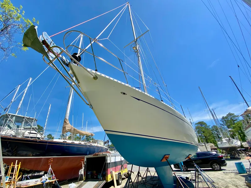 Slide: The Image of 1979 Valiant 37 sailboat on dry dock under clear blue sky. - 6