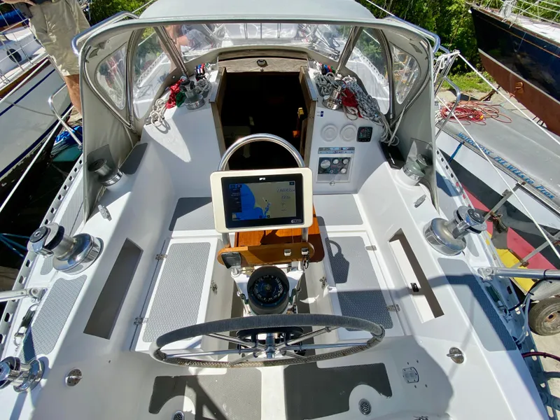 Slide: The Image of Cockpit of 1979 Valiant 37 sailboat with navigation equipment and steering wheel. - 9