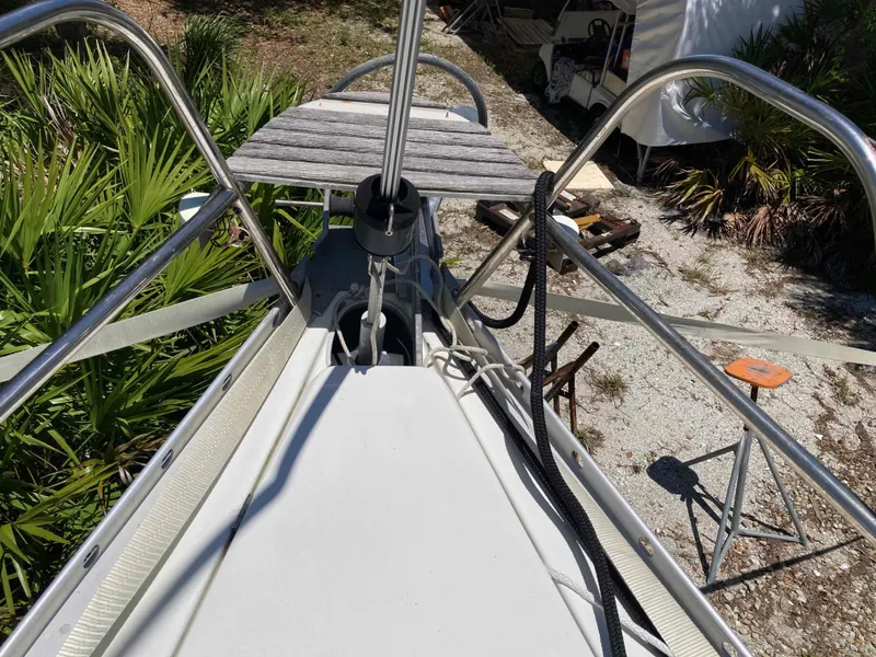 Slide: The Image of Bow of 1993 Beneteau Oceanis 370 sailboat with anchor and ropes. - 11