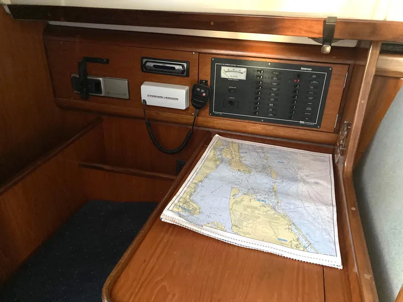 Slide: The Image of Navigation station on 1993 Beneteau Oceanis 370 with map and control panel. - 15