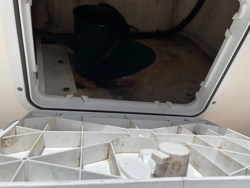 Slide: The Image of Open storage compartment on a 2015 Edgewater 188CC boat, showing interior details. - 12