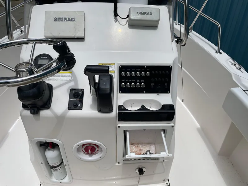 Slide: The Image of Control panel of a 2015 Edgewater 188CC boat with Simrad electronics. - 2