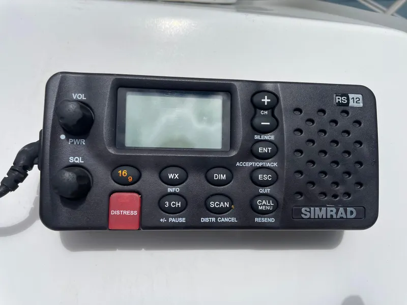 Slide: The Image of Simrad RS12 marine radio on 2015 Edgewater 188CC boat dashboard. - 3