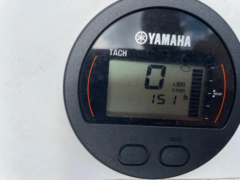 Slide: The Image of Yamaha tachometer displaying 151 hours on a 2015 Edgewater 188CC boat. - 4