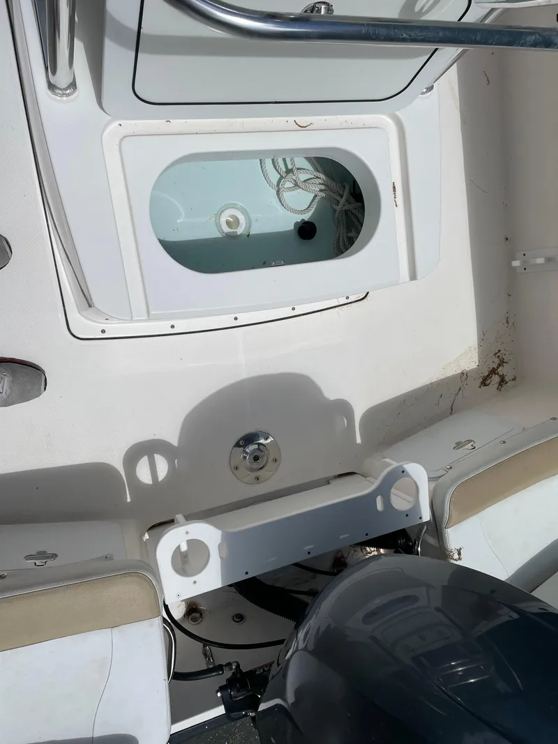 Slide: The Image of 2015 Edgewater 188CC boat interior with storage compartment and seating. - 7