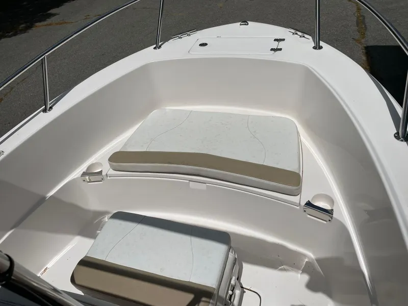 Slide: The Image of 2015 Edgewater 188CC boat interior with cushioned seating and stainless steel railings. - 9