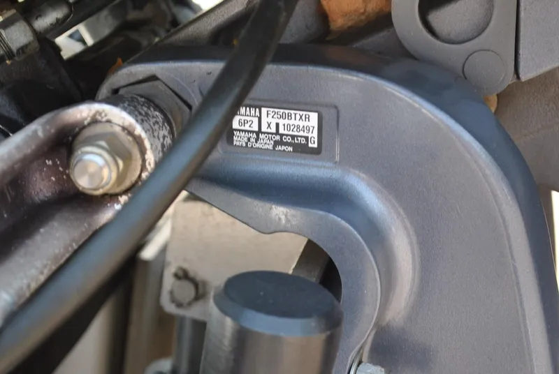 Slide: The Image of Close-up of a Yamaha F250B TXR engine part on a 2010 Pathfinder 2400 Tournament Edition boat. - 10