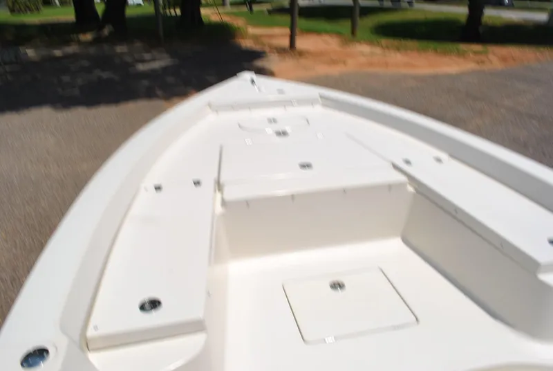 Slide: The Image of 2010 Pathfinder 2400 Tournament Edition boat deck, white with storage compartments. - 11