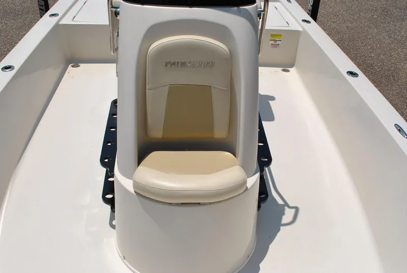 Slide: The Image of 2010 Pathfinder 2400 Tournament Edition boat console with cushioned seat. - 16