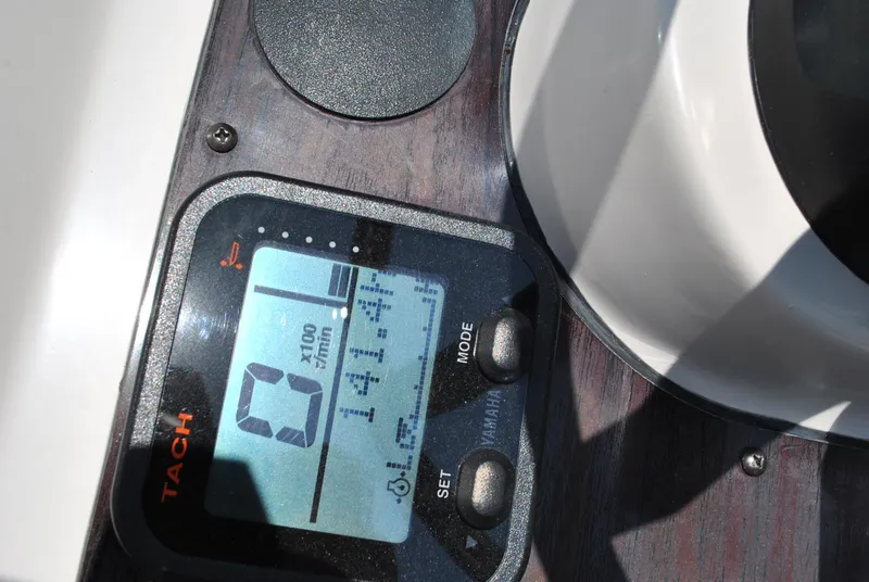 Slide: The Image of Tachometer display on 2010 Pathfinder 2400 Tournament Edition boat dashboard. - 19