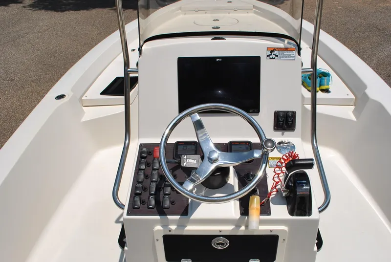 Slide: The Image of Steering console of 2010 Pathfinder 2400 Tournament Edition boat with controls and navigation equipment. - 20