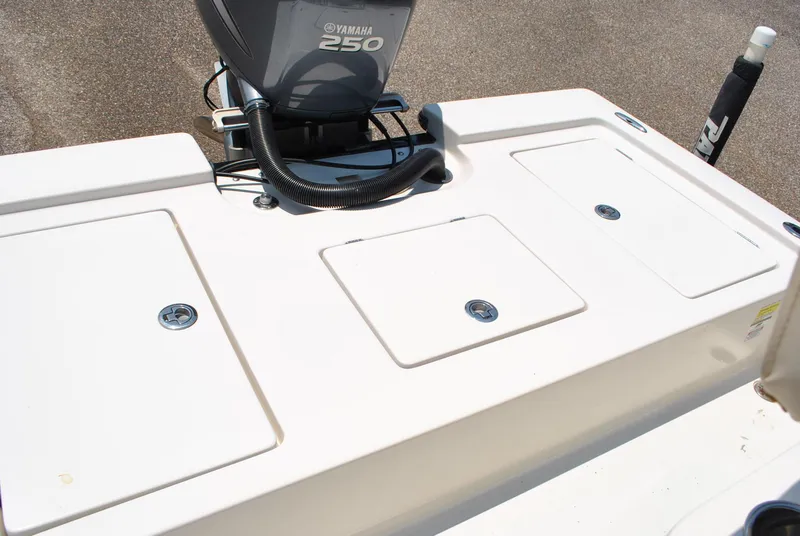 Slide: The Image of 2010 Pathfinder 2400 Tournament Edition boat with Yamaha 250 engine, featuring storage compartments. - 27