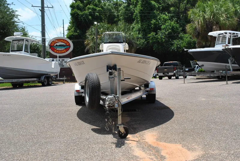 Slide: The Image of 2010 Pathfinder 2400 Tournament Edition boat on trailer in marina parking lot. - 5