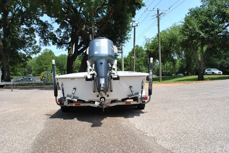 Slide: The Image of 2010 Pathfinder 2400 Tournament Edition boat on trailer, rear view in a sunny park setting. - 8