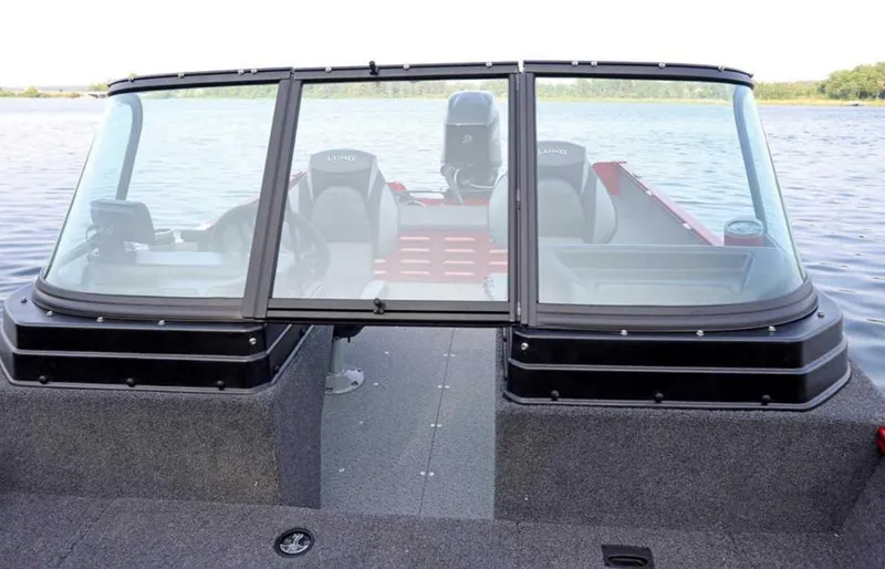 Slide: The Image of 2026 Lund 1650 Angler boat with windshield, on calm water. - 10