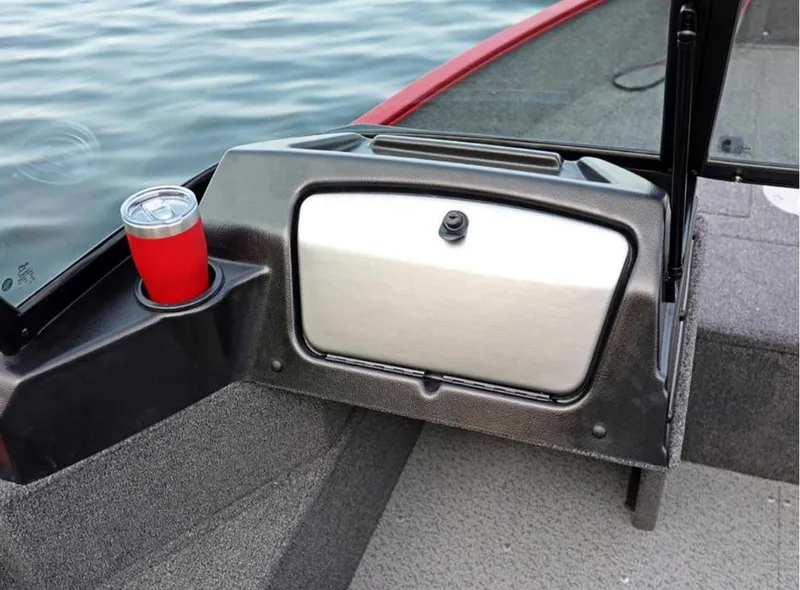 Slide: The Image of 2026 Lund 1650 Angler boat interior with cup holder and storage compartment. - 8