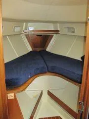 Slide: The Image of Cozy cabin interior of 1986 Pearson 36-2 sailboat with blue bedding. - 11