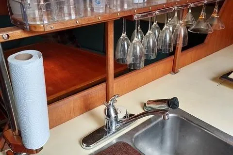 Slide: The Image of Galley sink with hanging glasses in a 1986 Pearson 36-2 sailboat. - 4