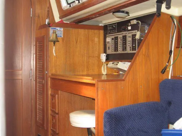 Slide: The Image of Interior of 1986 Pearson 36-2 sailboat with navigation station and wooden cabinetry. - 7