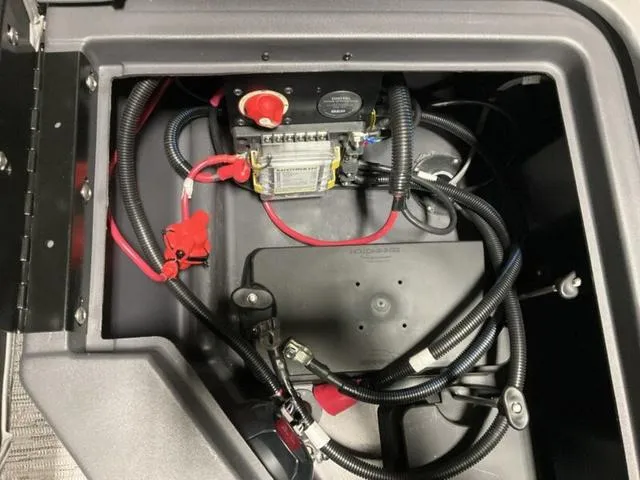Slide: The Image of Electrical wiring and components inside a 2025 Bennington M Quad Bench 22 MFB boat. - 16