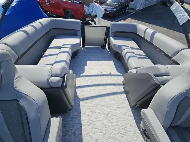 Slide: The Image of 2025 Bennington M Quad Bench 22 MFB pontoon boat interior with spacious seating and modern design. - 2