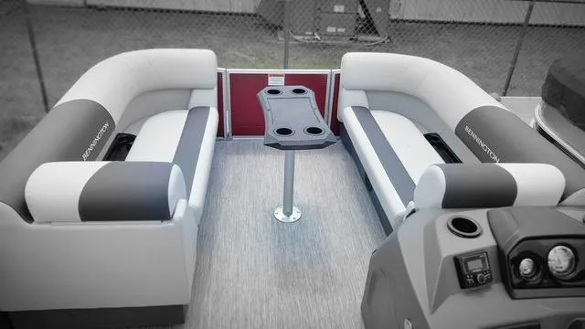 Slide: The Image of 2025 Bennington S Quad Bench 22 SSR interior with dual seating and central table. - 3