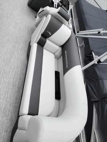 Slide: The Image of 2025 Bennington S Quad Bench 22 SSR boat seating, featuring sleek gray and white upholstery. - 6