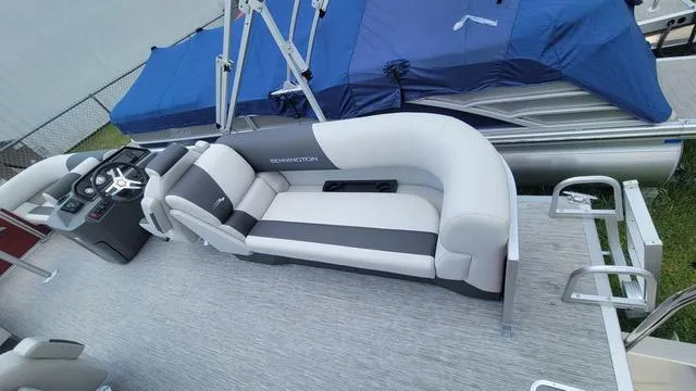 Slide: The Image of 2025 Bennington S Quad Bench 22 SSR pontoon boat with sleek seating and modern design. - 7