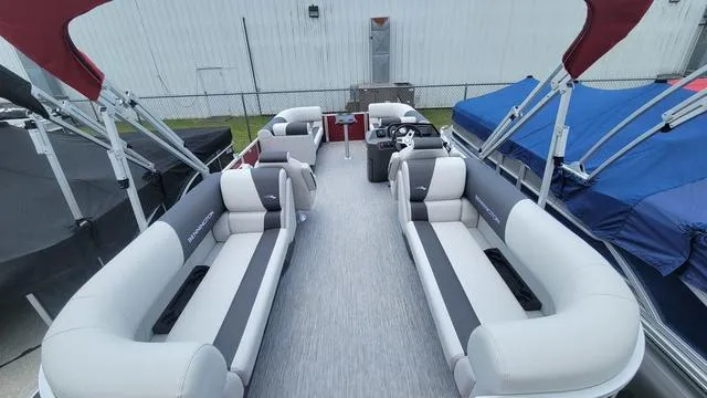 Slide: The Image of 2025 Bennington S Quad Bench 22 SSR pontoon boat with spacious seating and modern design. - 8