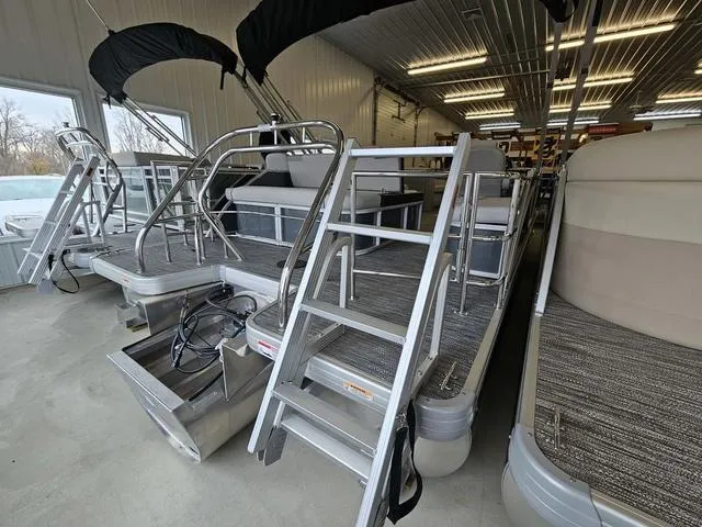 Slide: The Image of 2025 Godfrey Pontoons Sweetwater 2286 SFL GTP with center tube package in showroom. - 12