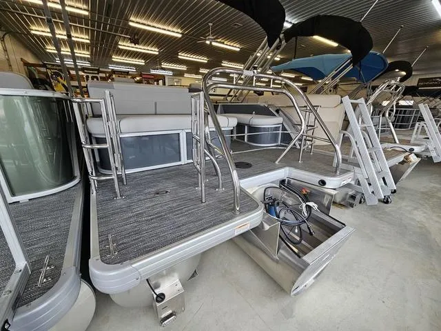 Slide: The Image of 2025 Godfrey Pontoons Sweetwater 2286 SFL GTP with center tube package in showroom. - 13